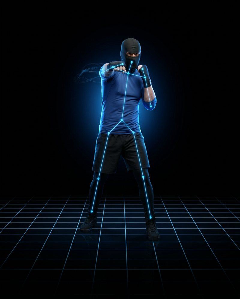 The boxer shadowboxing with a tracking skeleton drawn over him